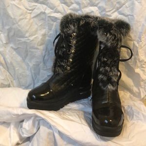 Fur trimmed black lace up boots